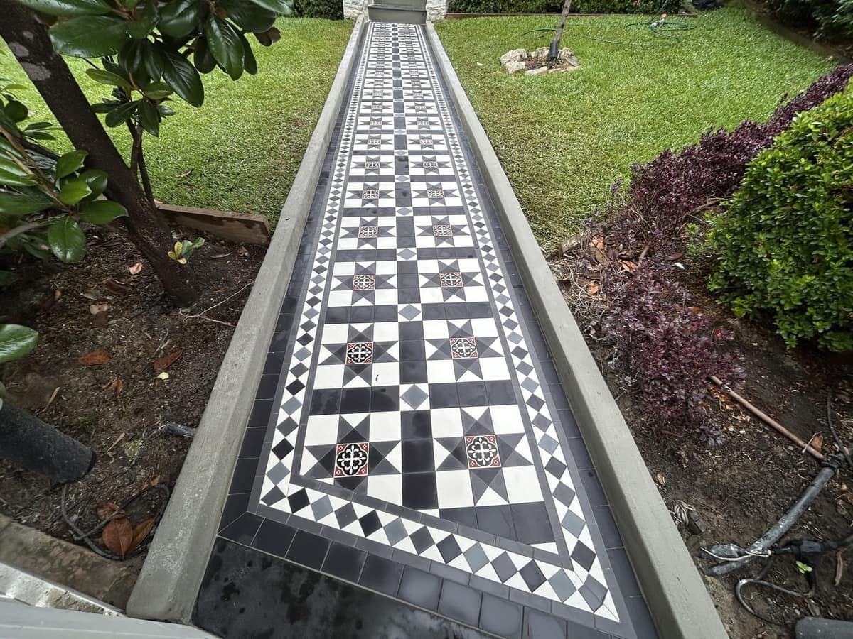 Black and white Paddington star path with a Norwood border running to the gate between gardens, Drummoyne