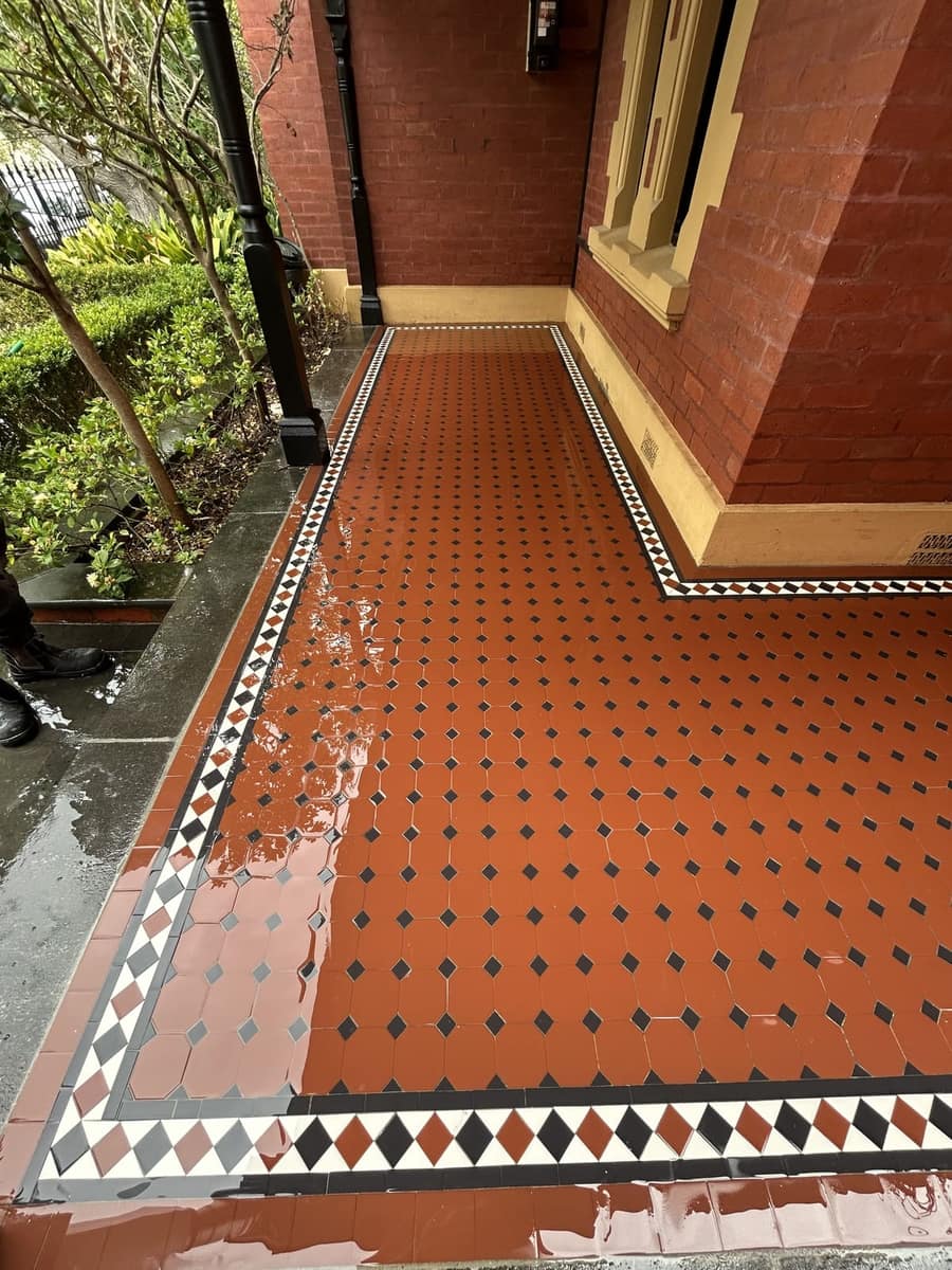 Octagon and Dot verandah corner return below a bay window on a red-brick Victorian, South Yarra